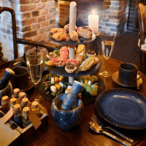 Prosecco and shared plates, alchemist's afternoon tea Krakow