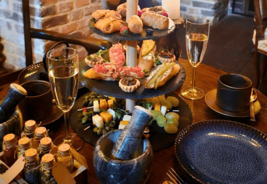 Prosecco and shared plates, alchemist's afternoon tea Krakow
