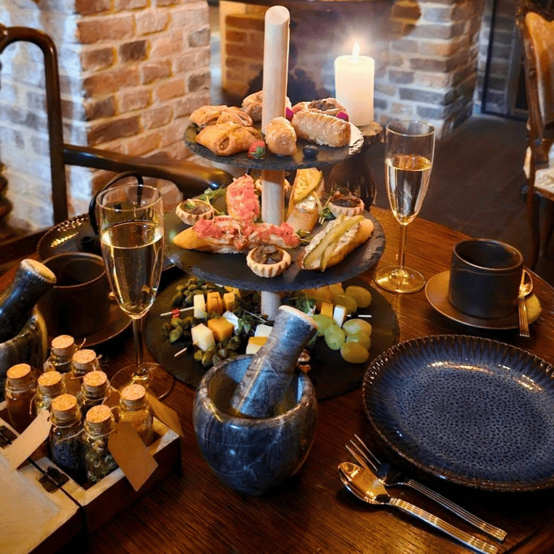 Prosecco and shared plates, alchemist's afternoon tea Krakow
