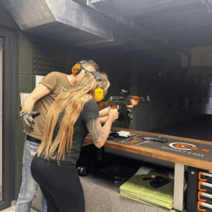 Guest firing a rifle with instructor guidance, Krakow shooting range