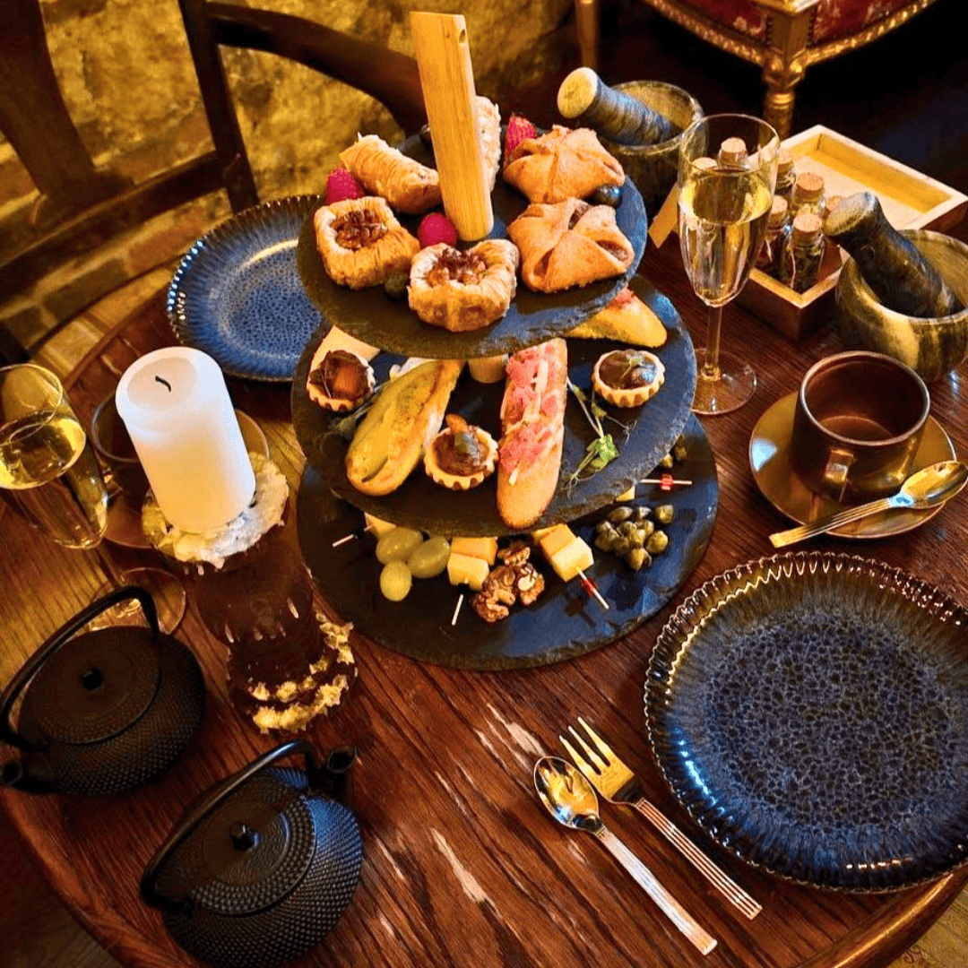 Prosecco and shared plates, alchemist's afternoon tea Krakow