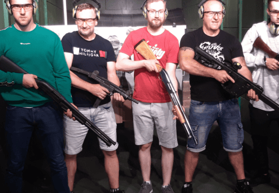 Guest aiming a rifle down the range, Krakow shooting range